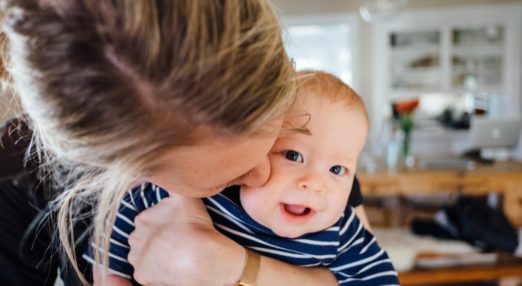 Mum kissing baby boy