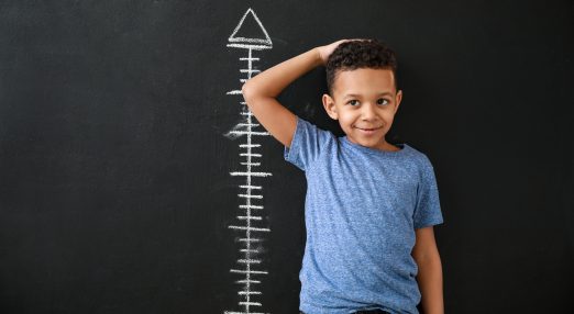 A child measuring his height