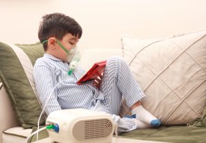 Boy using a nebuliser