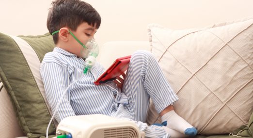 Boy using a nebuliser